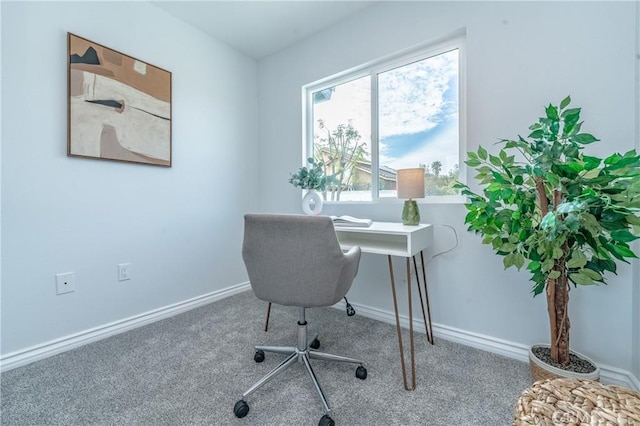 carpeted office with baseboards