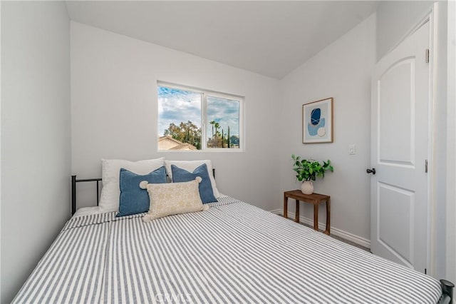 bedroom featuring vaulted ceiling