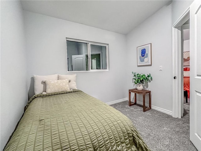 carpeted bedroom with baseboards