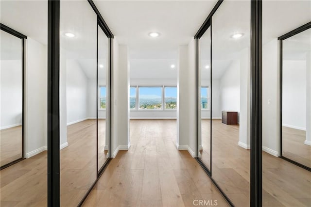 corridor featuring light hardwood / wood-style floors