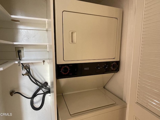 laundry room featuring stacked washer and dryer