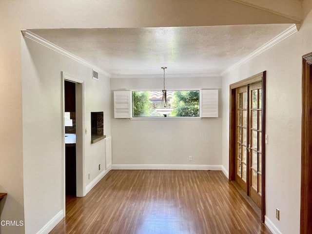 205 Pirie Rd Unit 64, Ojai, CA 93023 - unfurnished dining area featuring wood finished floors, ornamental molding, and a textured ceiling
