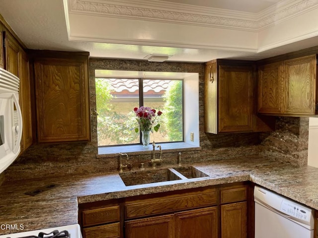 205 Pirie Rd Unit 64, Ojai, CA 93023 - kitchen featuring white dishwasher, tasteful backsplash, and brown cabinets