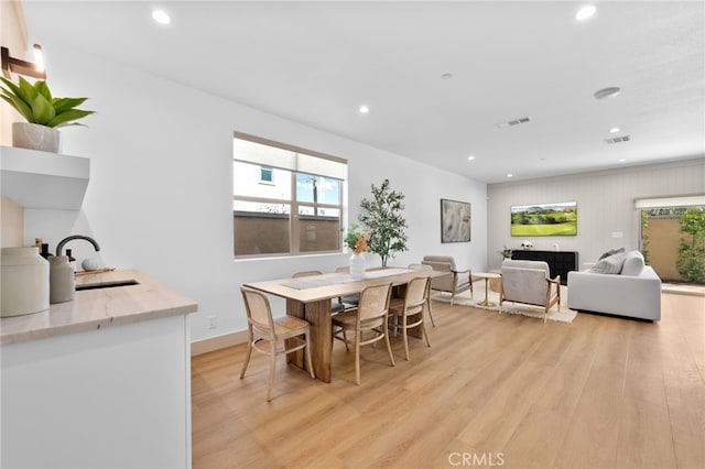 dining area with recessed lighting, visible vents, and light wood-type flooring