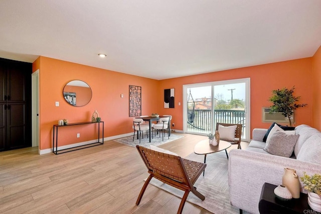 living room with light hardwood / wood-style flooring