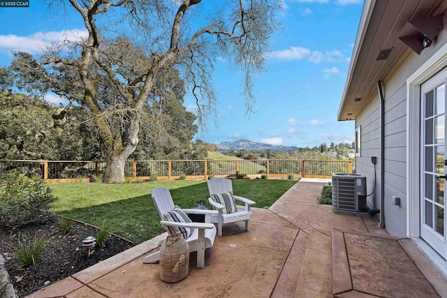 view of patio / terrace featuring central AC and a mountain view