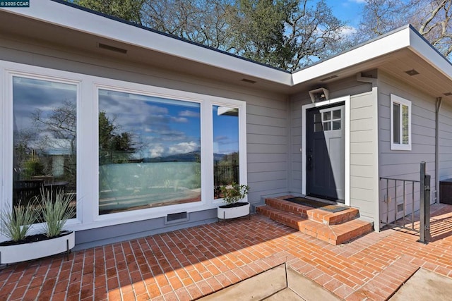 doorway to property with a patio