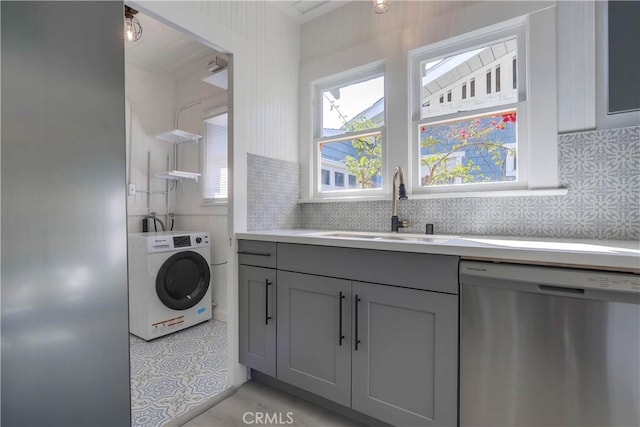 laundry room featuring washer / dryer and sink