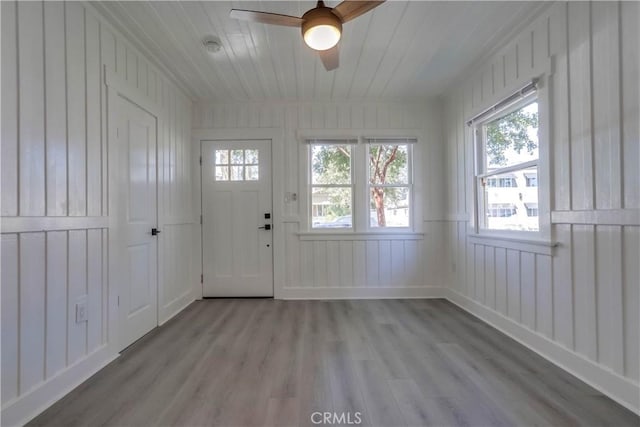 interior space with ceiling fan and light hardwood / wood-style floors