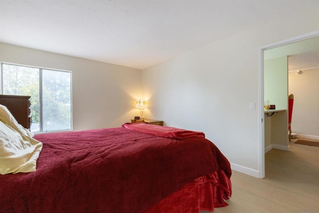 bedroom featuring light wood-type flooring