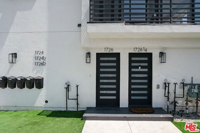 property entrance with a balcony