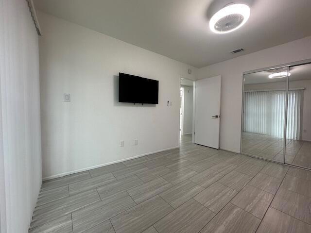 unfurnished bedroom featuring a closet