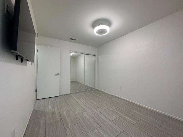 unfurnished bedroom featuring a closet