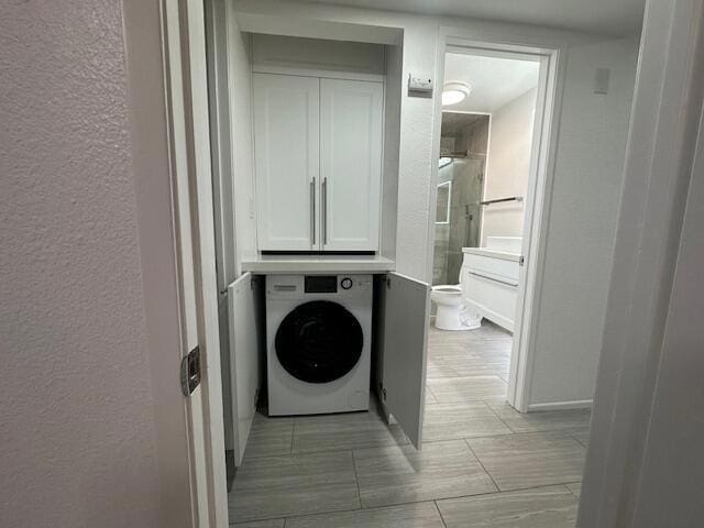 washroom with washer / clothes dryer