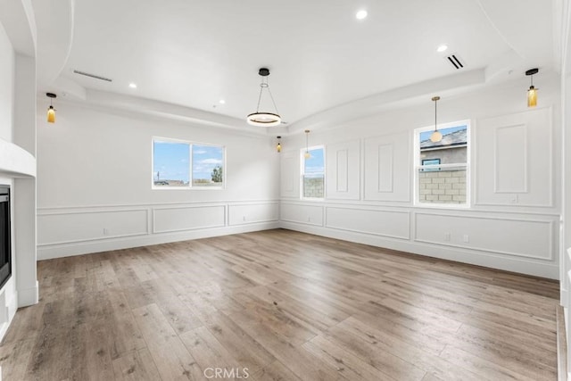 unfurnished living room featuring light wood-type flooring