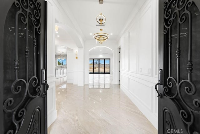 foyer featuring crown molding