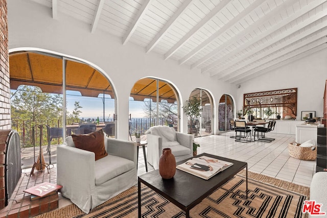 tiled living room with beam ceiling, high vaulted ceiling, and wooden ceiling