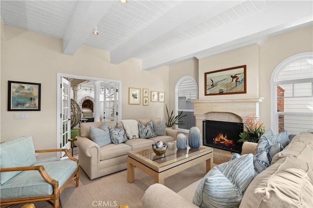 living room with beam ceiling and french doors