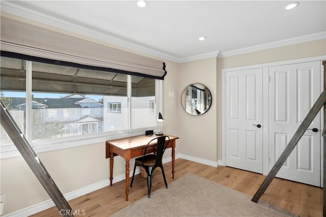 office area with hardwood / wood-style flooring and ornamental molding