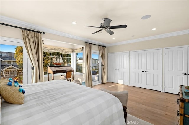 bedroom featuring multiple windows, access to exterior, crown molding, and light hardwood / wood-style floors