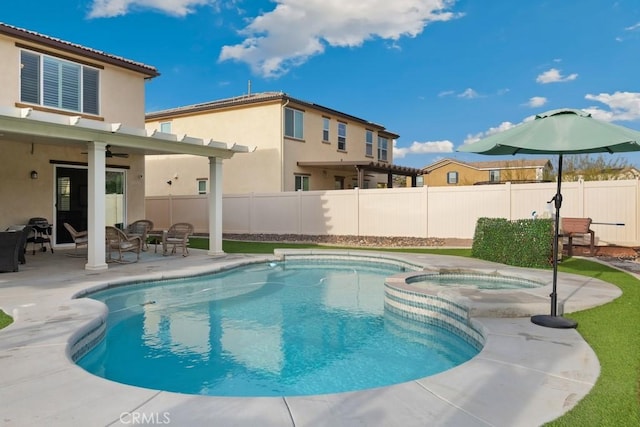 view of pool with a patio, ceiling fan, and an in ground hot tub