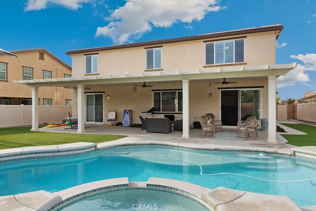 rear view of property with a pool with hot tub, an outdoor hangout area, a patio, and ceiling fan