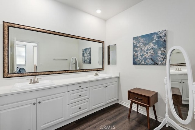 bathroom with vanity and hardwood / wood-style flooring