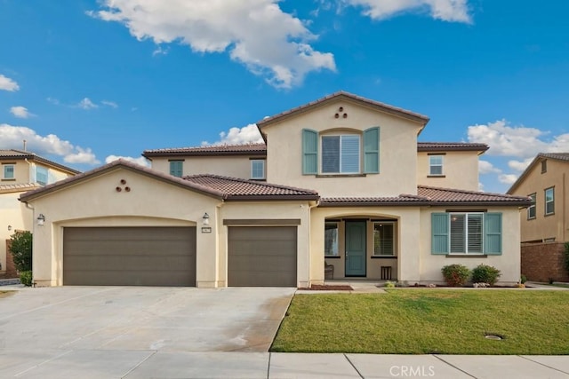 mediterranean / spanish-style house with a garage and a front lawn