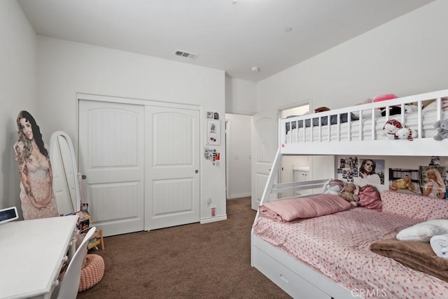 carpeted bedroom with a closet