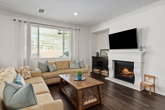 living room with crown molding and dark hardwood / wood-style flooring