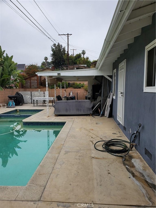 view of pool featuring a patio