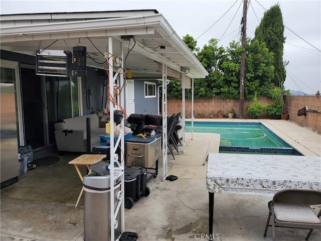 view of pool featuring a patio