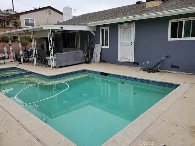 view of pool featuring a patio area