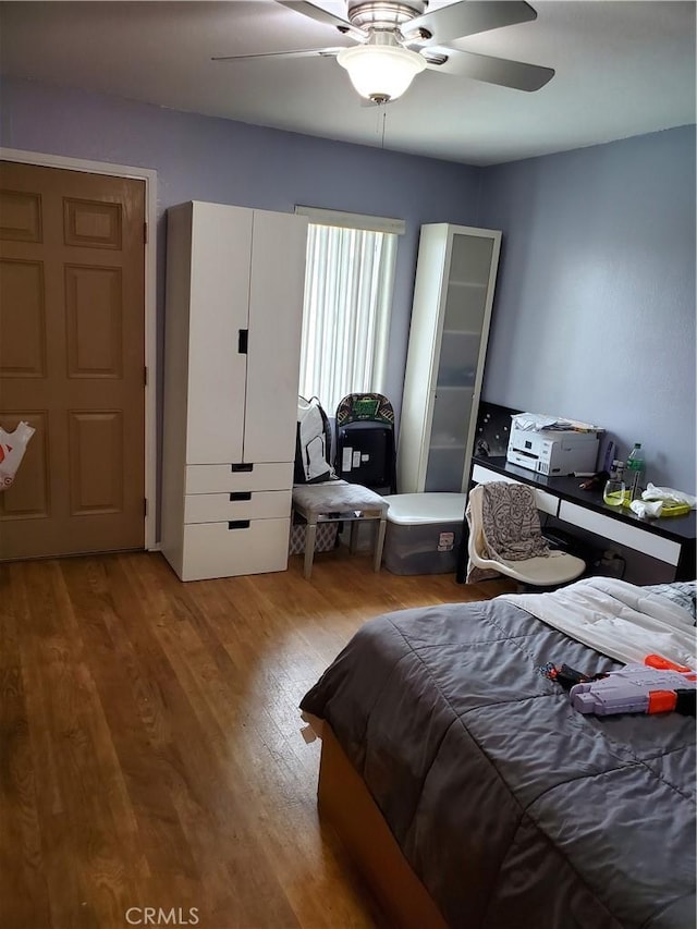 bedroom featuring ceiling fan and hardwood / wood-style floors