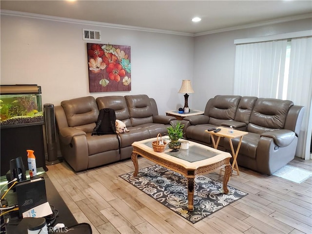 living room with crown molding and light hardwood / wood-style floors