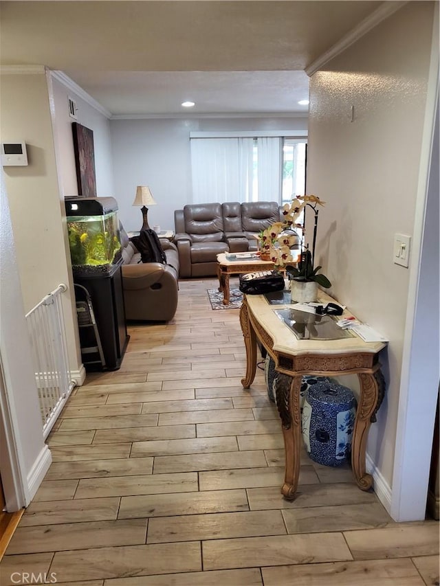 living room featuring crown molding