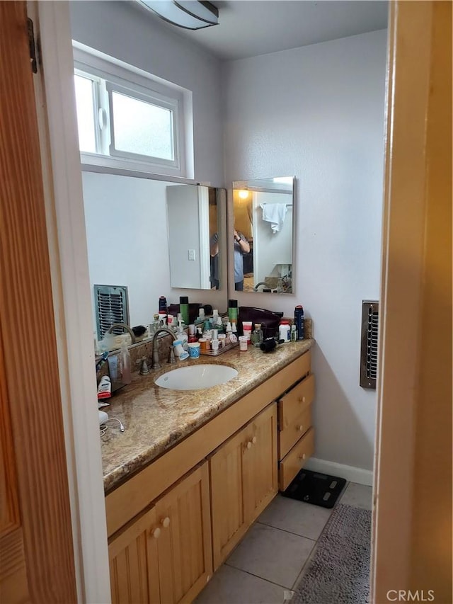 bathroom featuring tile patterned floors and vanity