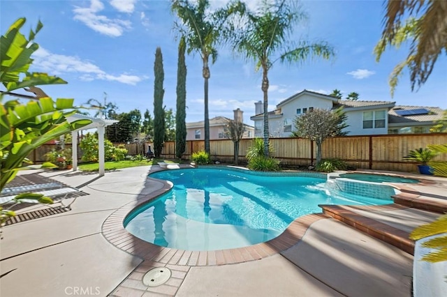 view of swimming pool with a patio area and an in ground hot tub