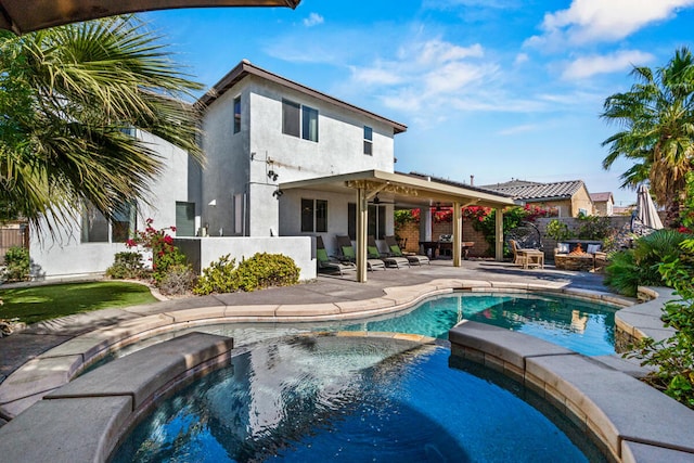 exterior space featuring a fenced in pool and a patio area