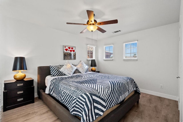 bedroom featuring ceiling fan and light wood-type flooring