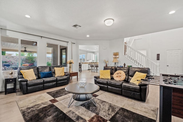 living room with light hardwood / wood-style flooring