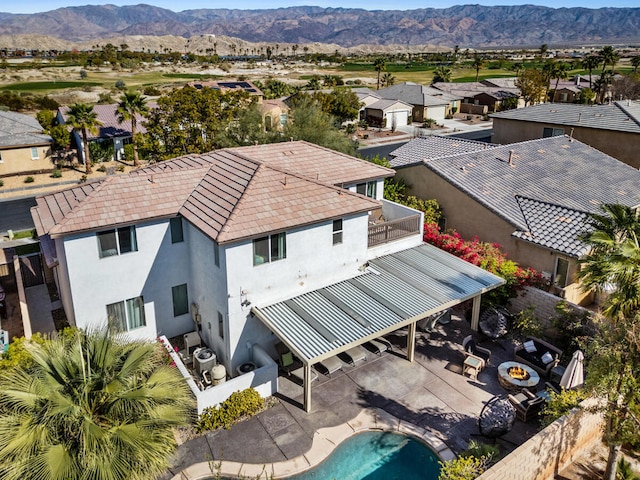 birds eye view of property with a mountain view