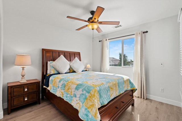 bedroom featuring light hardwood / wood-style flooring and ceiling fan