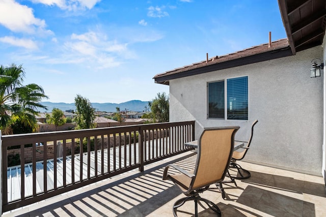 wooden terrace featuring a mountain view