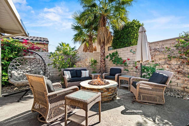 view of patio / terrace with a fire pit