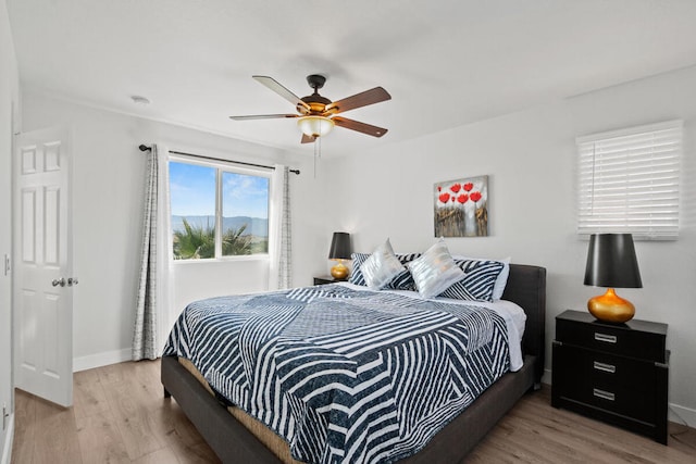 bedroom featuring ceiling fan and light wood-type flooring