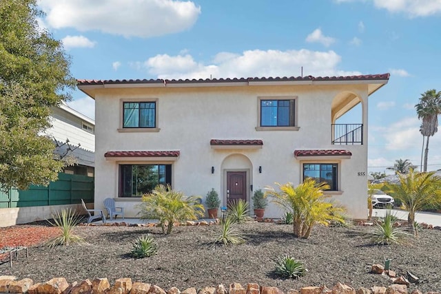 mediterranean / spanish-style house featuring a balcony