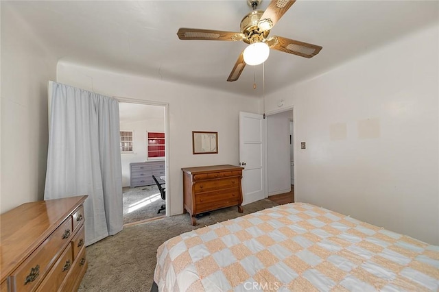 bedroom featuring light carpet and ceiling fan