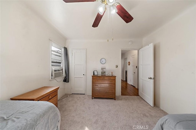 carpeted bedroom featuring cooling unit and ceiling fan