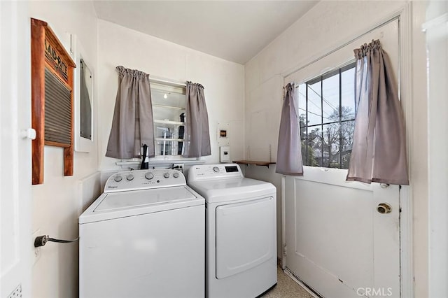 clothes washing area featuring washing machine and dryer